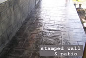 stamped concrete wall finish and patio